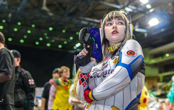 Cosplayer at Yorkshire Cosplay Con. Cosplayer dressed as a mashup cosplay of 'D.Va' from the video game Overwatch and Harley Quinn from DC Comics at the Yorkshire Cosplay Con at Sheffield Arena. harley quinn cosplay stock pictures, royalty-free photos & images