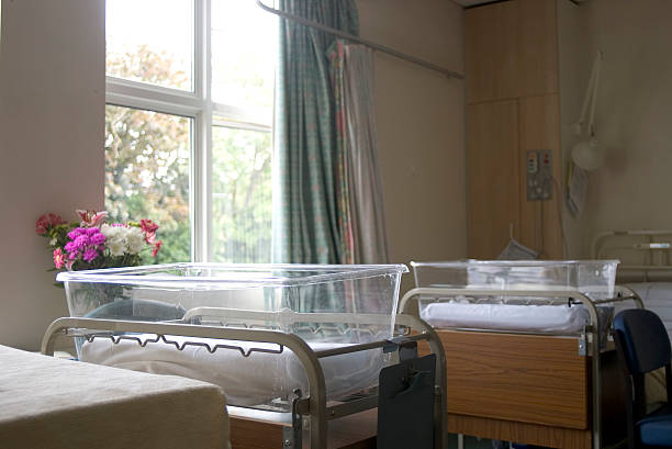 Cots in hospital maternity ward stock photo