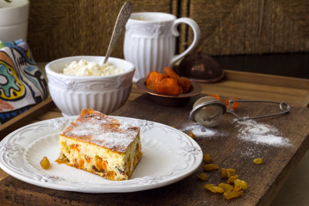 Cottage cheese casserole with raisins and dried apricots. Rustic style. stock photo