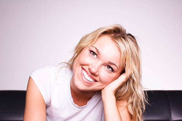 Couch Portrait Young Adult Blonde Woman hf7 stock pictures, royalty-free photos & images