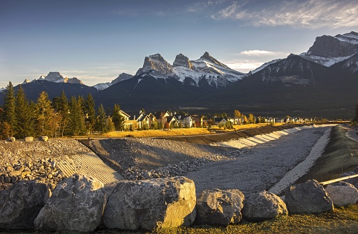 Cougar Creek Berm Town of Canmore Alberta Foothills with Distant Snowy Three Sisters Mountain Landscape near Banff National Park in Canadian Rockies