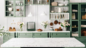 istock Countertop with green vintage kitchen furniture in blurred background 1336085276