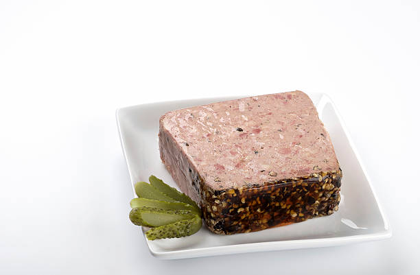 Country Pate "Country style meat pate or terrine, garnished with a gherkin." pate stock pictures, royalty-free photos & images