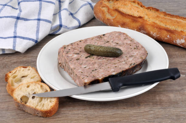 Country pâté plate with a pickle Plate of pâté de campagne with a pickle pate stock pictures, royalty-free photos & images