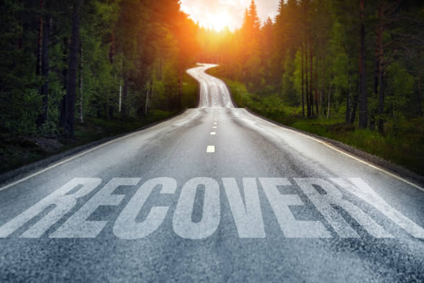 Country road and Recovery written on the road Country road and Recovery written on the road rehabilitation stock pictures, royalty-free photos & images
