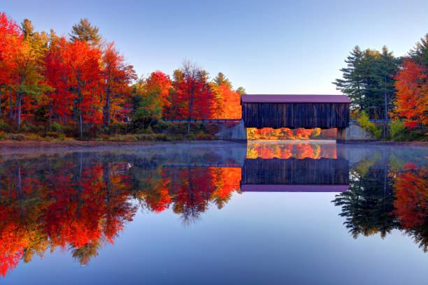 County Covered Bridge near Greenfield, New Hampshire The County Covered Bridge near Greenfield and Hancock, NH during the paek fall foliage season covered bridge stock pictures, royalty-free photos & images