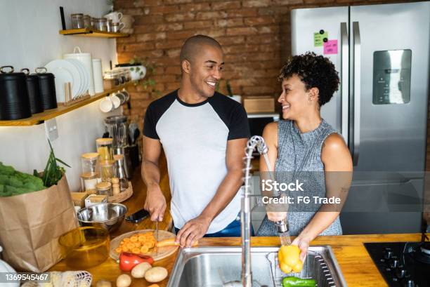 Couple cooking together at home
