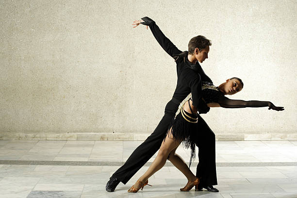 couple dancing latino-american dance - salsa dancing stok fotoğraflar ve resimler