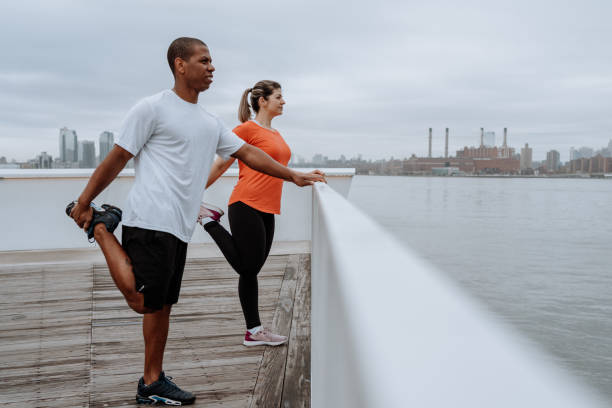Couple exercising in the city stock photo