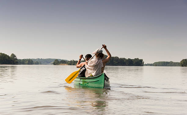 Couple in canoe stock photo