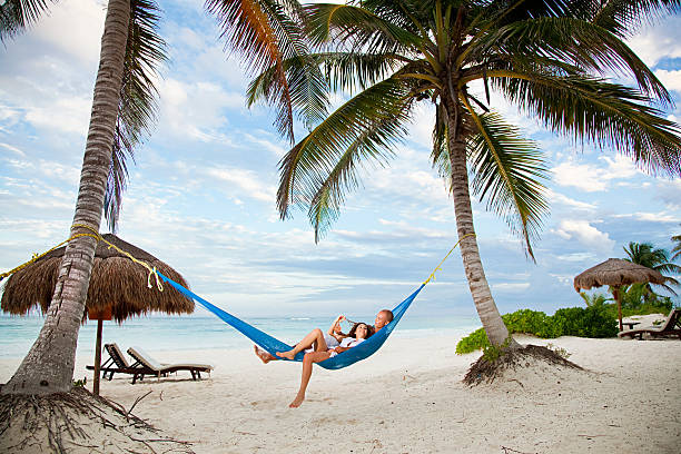 couple in hammock on vacation - hängmatta bildbanksfoton och bilder