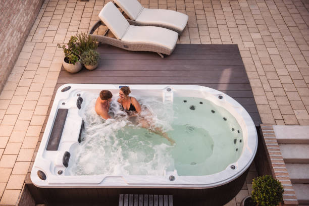 Couple in hot tub pool spa whirlpool stock photo