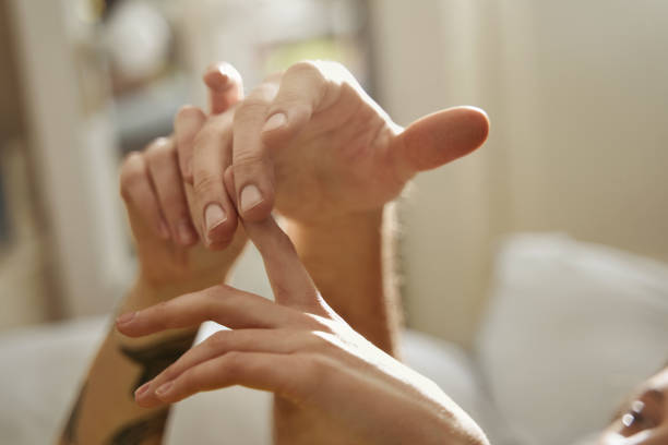 Couple in love touching with hands to each other while spending their morning stock photo