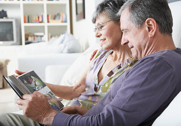 A couple looking at pictures  senior couple photos stock pictures, royalty-free photos & images