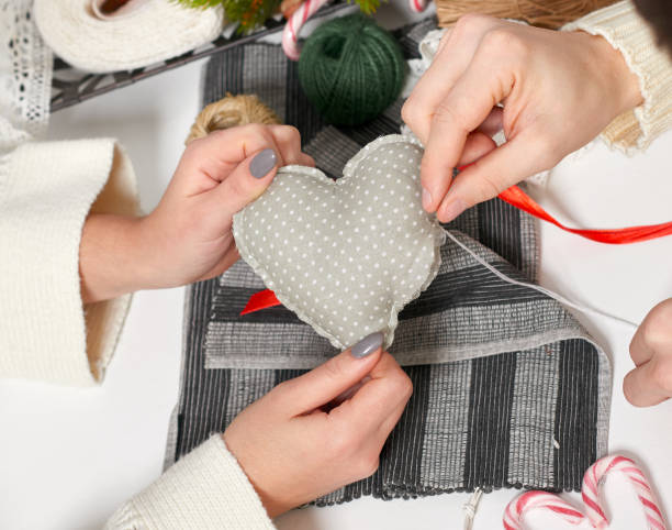 couple making decorations for Valentine's day, recover damaged heart,...