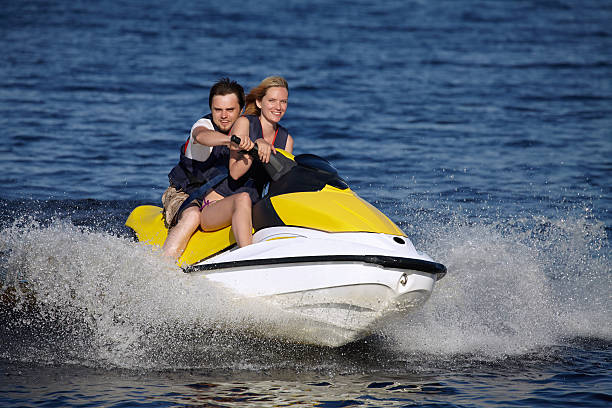 couple riding jet ski - vattenskoter motor bildbanksfoton och bilder