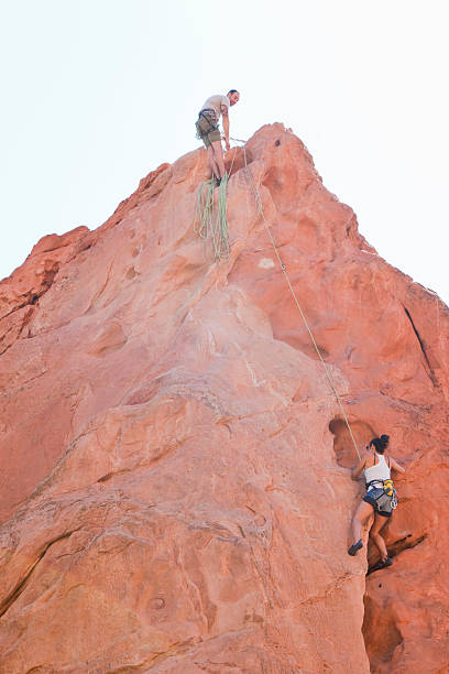 Couple Rock Climbing In Garden Of The Gods Stock Photo Download