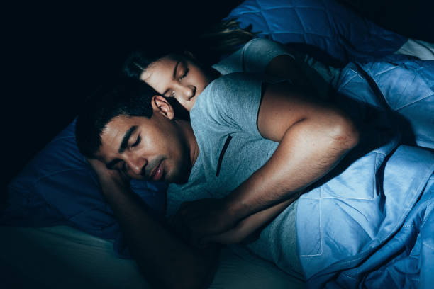 couple sleeping in bed. the sleeping couple relax in the bed. night time - sleeping couple imagens e fotografias de stock