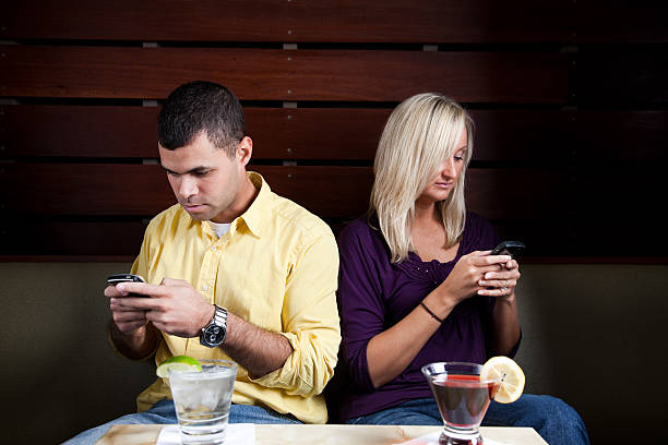 Couple Texting stock photo