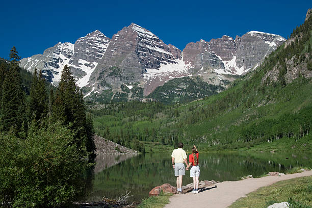 Couple viewing Maroon Bells stock photo