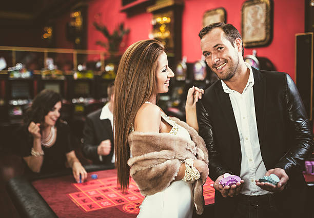 couple winning at the casino couple winning at the casino real money casino stock pictures, royalty-free photos & images