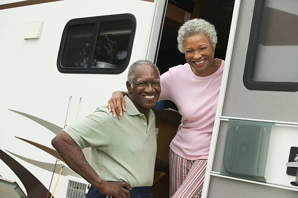 Couple with Their RV Couple with Their RV 50 59 years stock pictures, royalty-free photos & images
