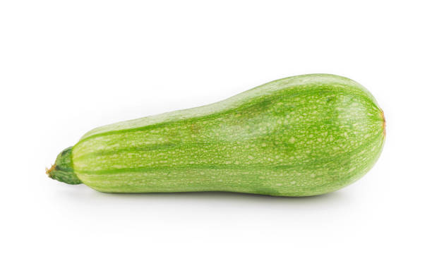 Courgette or zucchini. Courgette or zucchini. Isolated in a white background. Close-up. crop yield stock pictures, royalty-free photos & images
