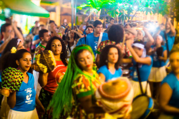 Courtship of maracatu - traditional folk dance with African roots - with the Batuki Kianda group in Ilhabela, Brazil, on April 16, 2017, walking the streets of the historic city center. Photos made with a tilt-shift lens. stock photo