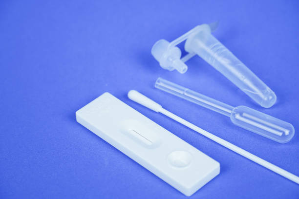 Covid antigen test set on blue background stock photo