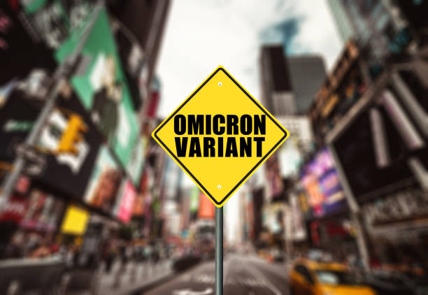 covid omicron variant alert street sign in times square stock photo
