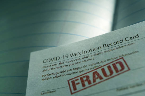 Covid vaccination card fraud stock photo
