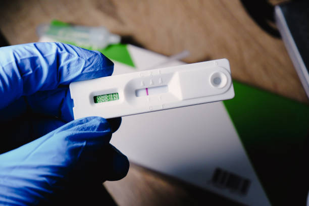 Covid-19 negative result cassette from a rapid antigen test kit stock photo
