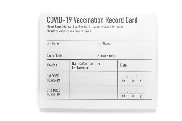 Covid-19 vaccination record card on white background Covid-19 vaccination record card cdc vaccine card stock pictures, royalty-free photos & images