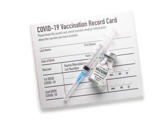 Covid-19 vaccination record card with syringe and vial Covid-19 vaccination record card cdc vaccine card stock pictures, royalty-free photos & images