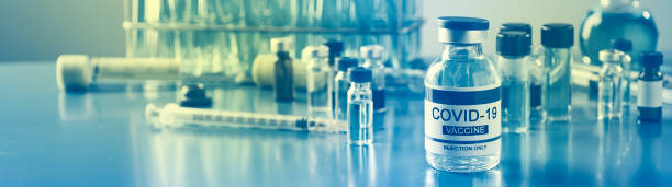 covid-19 vaccine bottle at the lab, web format stock photo