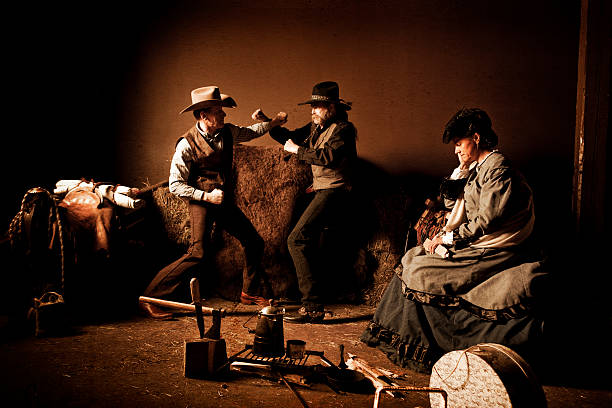 Cowboys fighting over a woman stock photo