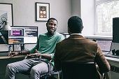 istock Coworkers having a chat at work 1336501122
