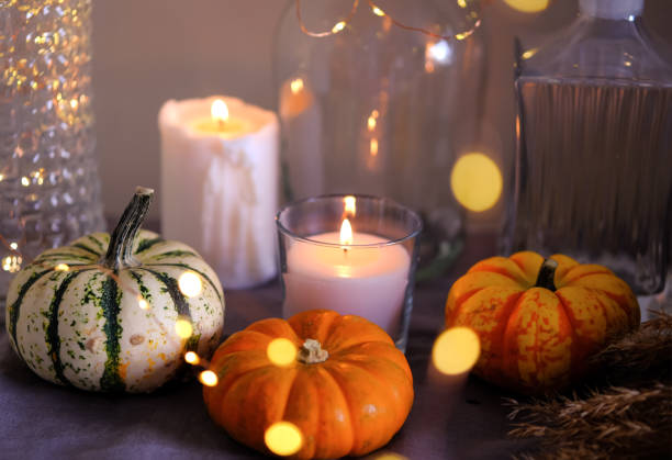 Cozy autumn home decor with candles and pumpking. stock photo