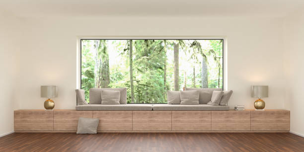 A cozy bench at a large panoramic window with built-in storage space. On the outside a rainforest landscape. 3d render A cozy bench at a large panoramic window with built-in storage space. On the outside a rainforest landscape. 3d render alcove window seat stock pictures, royalty-free photos & images