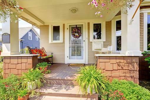Cozy Covered Porch With White Columns In American Cozy Covered Porch With White Columns In American