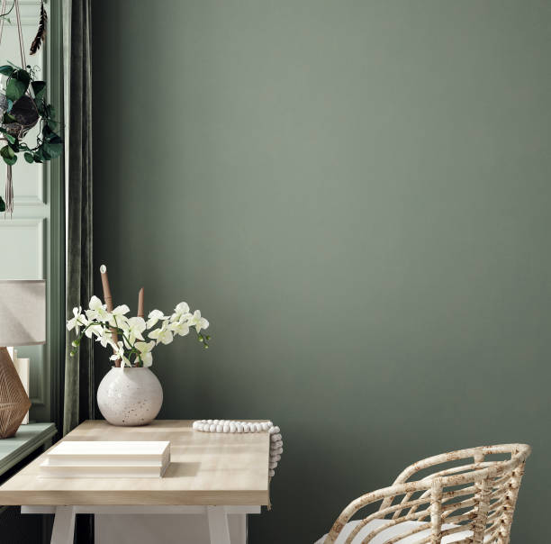 Cozy dark green workplace interior at home, wall mockup stock photo