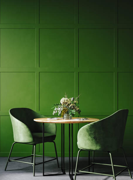 Cozy modern dining room interior in dark green colors stock photo