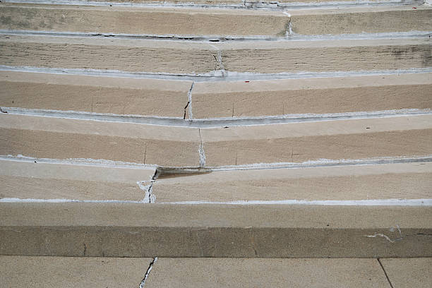 Cracked and broken cement steps stock photo