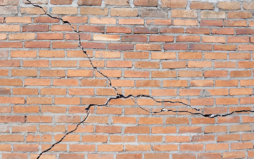 Brick building with cracked foundation