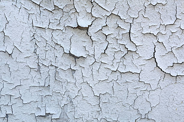 Cracked Paint Cracked Peeling Paint at Grunge Wall peeling off stock pictures, royalty-free photos & images