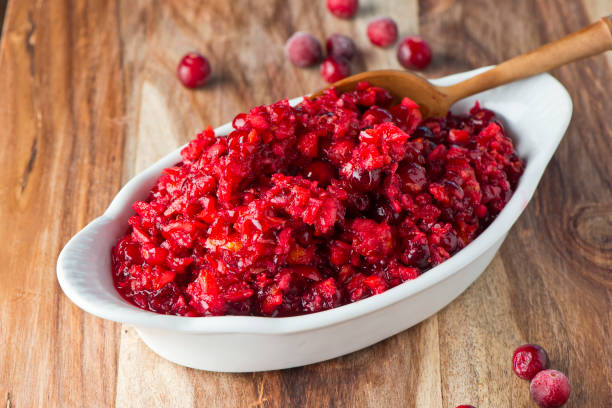Cranberry relish made with candies mandarin oranges, toasted pecans, walnuts and topped with sugar and over roasted. Classic American thanksgiving side dish. stock photo