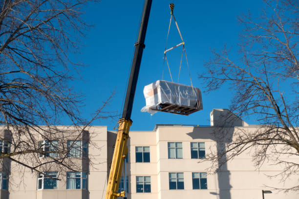 Crane Lifting HVAC Unit stock photo