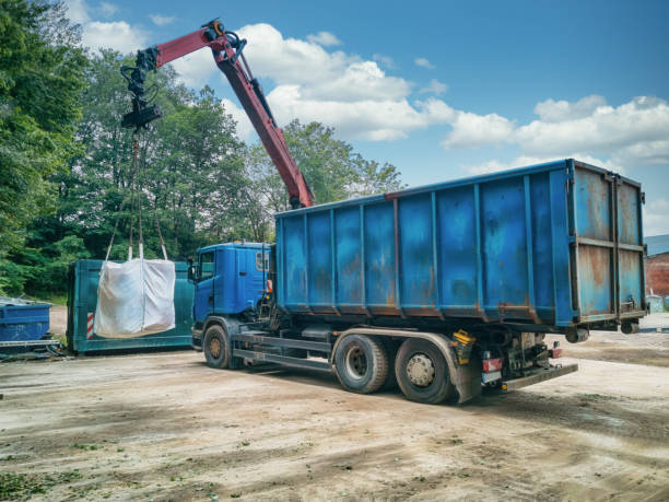 Crane truck with garbage bag on a recycling yard. stock photo
