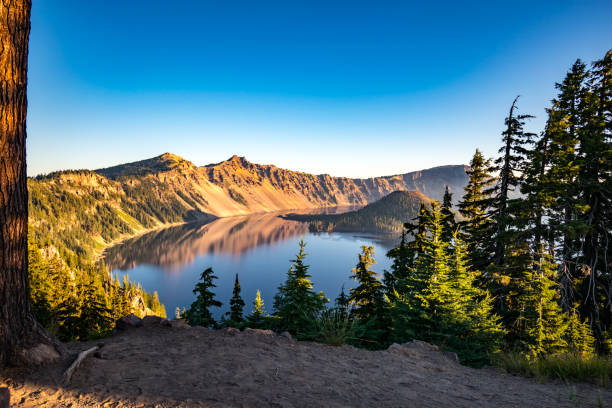 Crater Lake National Park at Sunrise Crater Lake cascade range stock pictures, royalty-free photos & images