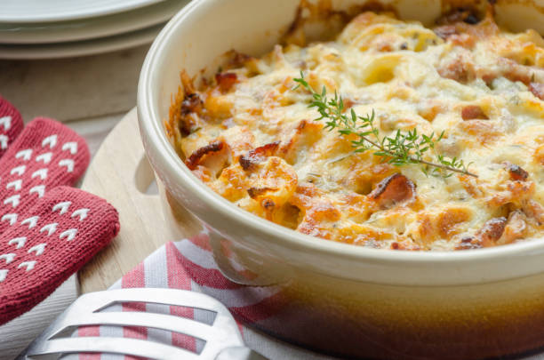 Creamy chicken and potato casserole Cheese-topped potato bake containing heavy cream, chicken, bacon onion and thyme ready to serve gratin stock pictures, royalty-free photos & images